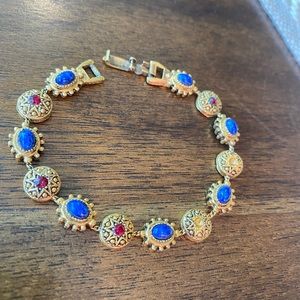 7” vintage gold tone bracelet with blue and red stones